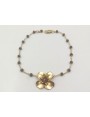 Pulsera facetadas gris y flor oro