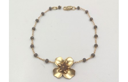 Pulsera facetadas gris y flor oro