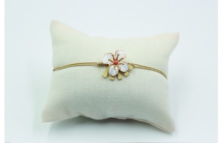 Pulsera nudo serpiente en color oro palido con flo