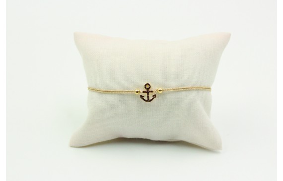 Pulsera de macrame en color oro palido y ancla dor