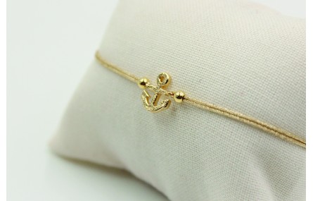Pulsera de macrame en color oro palido y ancla dor