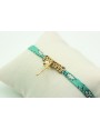 Pulsera lazo liberty azul con flores blancas, macr