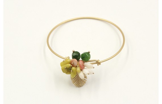 Pulsera rigida en oro mate con hoja de palmera y s