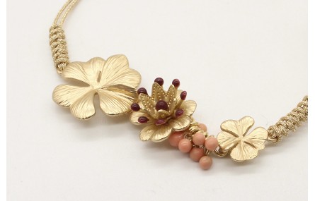 Pulsera nudo serpiente oro palido con trio de flor