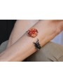 Pulsera rigida con escarabajo esmaltado negro y bu