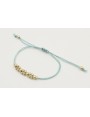 Pulsera hilo macrame menta con  bolas en oro mate.