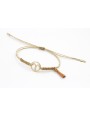 Pulsera hilo macrame oro palido con nudo dorado di