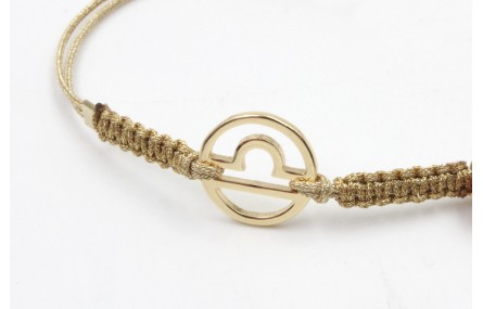 Pulsera hilo macrame oro palido con nudo dorado di