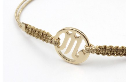 Pulsera hilo macrame oro palido con nudo dorado di