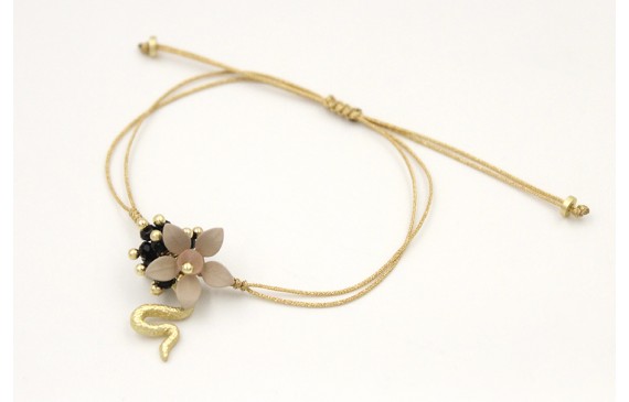 Pulsera nudo serpiente oro pálido con flor esmalta