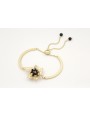 Pulsera semi rigida en oro mate con centro hoja de