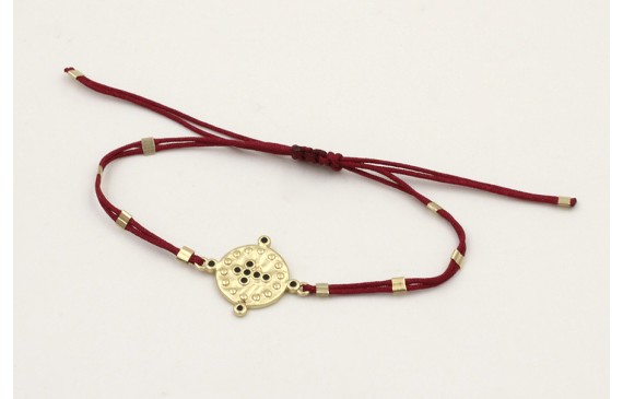 Pulsera hilo granate con tubitos aplastados y entr