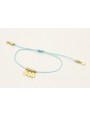 Pulsera hilo azul con colgantes laminas labradas y