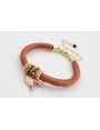Pulsera de seda rellena color cobrizo con aritos d