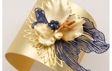 Brazalete rigido flor de loto,pez tropical azul os