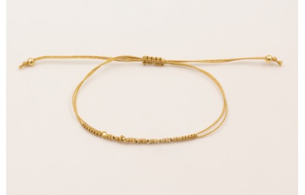 Pulsera hilo macramé dorado con mini facetas dorad