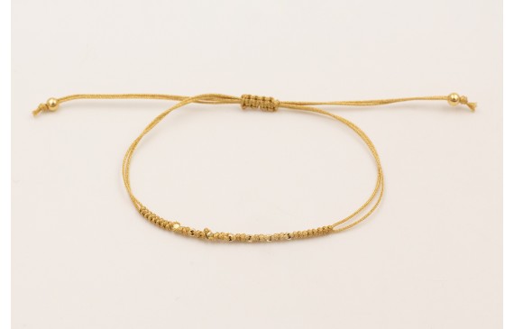 Pulsera hilo macramé dorado con mini facetas dorad