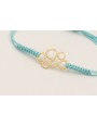 Pulsera hilo azul claro con pieza 6 aros dorada ma