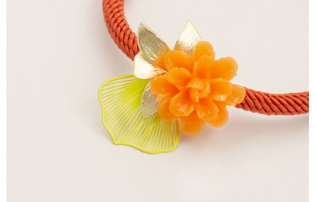 Pulsera cordón color oxido con centro flor resina