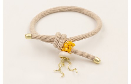 Pulsera goma color beige con burruño facetadas ama
