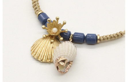 Pulsera nudo serpiente en oro palido con piedras a