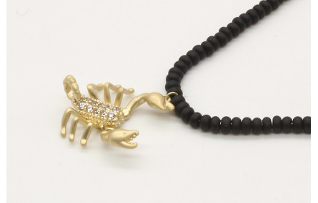 Solitario cadena fina oro brillo con abalorio en n