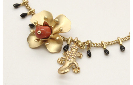 Pulsera cadena cerillas negras con flores oro mate