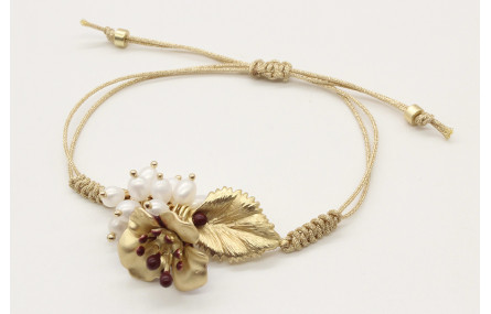 Pulsera nudo serpiente en oro palido con hoja, flo