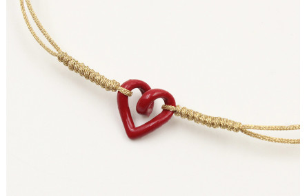 Pulsera nudo serpiente dorado con corazón hueco ro