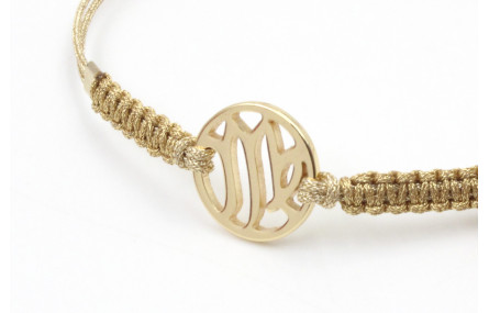 Pulsera hilo macrame oro palido con nudo dorado di