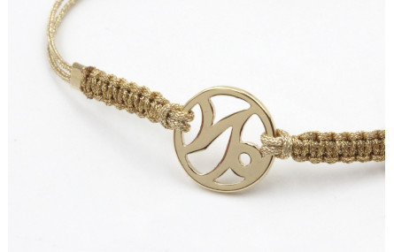 Pulsera hilo macrame oro palido con nudo dorado di