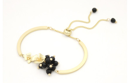 Pulsera semi rigida en oro mate con centro de flor