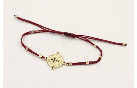 Pulsera hilo granate con tubitos aplastados y entr