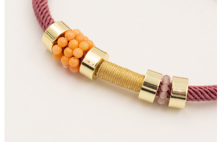 Pulsera cordón retorcido color coral,ruedas dorada