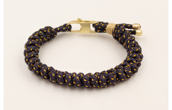Pulsera cordón azul petróleo con hilo dorado nudo 