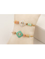 Pulsera de acero inoxidable con hilo dorado nudo s