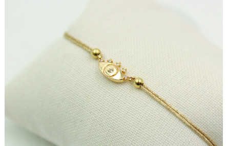 Pulsera de macrame en color oro palido y ojo turco