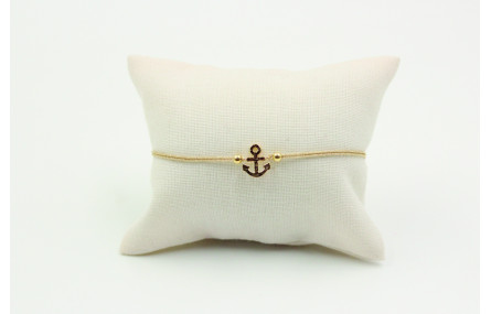 Pulsera de macrame en color oro palido y ancla dor