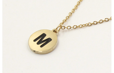 Solitario de acero inoxidable con chapa letra M ne