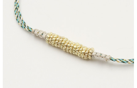 Pulsera macrame azul,gris y oro con nudo macrame p