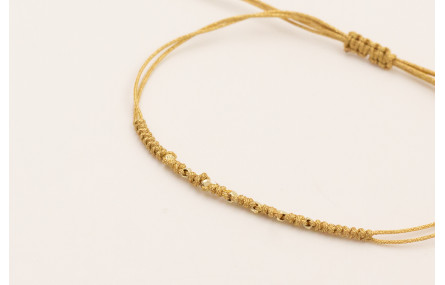 Pulsera hilo macramé dorado con mini facetas dorad