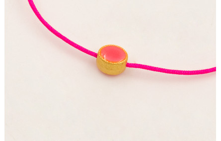 Pulsera hilo rosa fluor con entrepieza ovalada esm