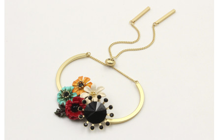 Pulsera semirigida oro mate con centro de flores e