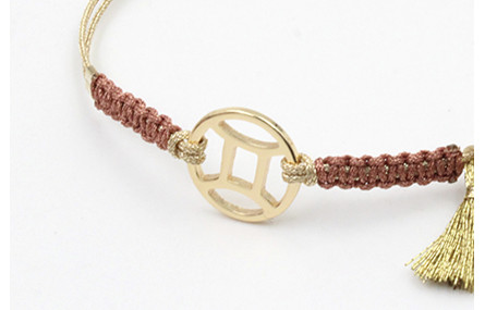 Pulsera hilo macrame oro palido con nudo oro rosa