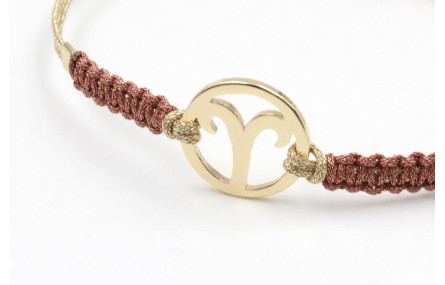 Pulsera hilo macrame oro palido con nudo oro rosa