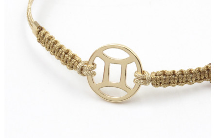 Pulsera hilo macrame oro palido con nudo dorado di