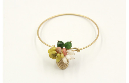 Pulsera rigida en oro mate con hoja de palmera y s