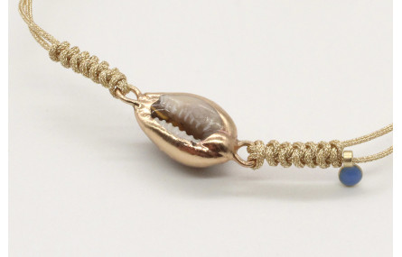Pulsera nudo serpiente oro palido con caracola bor