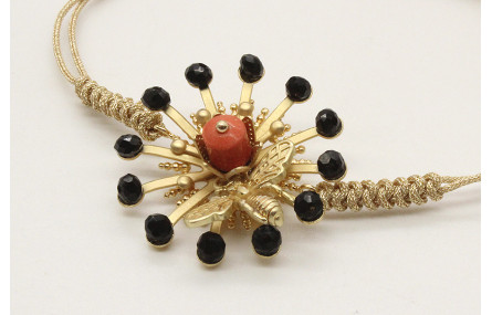 Pulsera nudo serpiente oro palido con sol,casquill