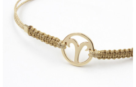 Pulsera hilo macrame oro palido con nudo dorado di